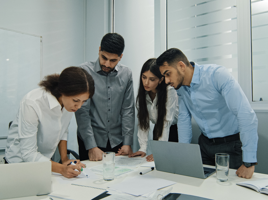Woman team leader, successful employee mentor training diversity subordinates at corporate workshop presentation. Female business coach top manager presenting new project plan at conference office. High quality photo